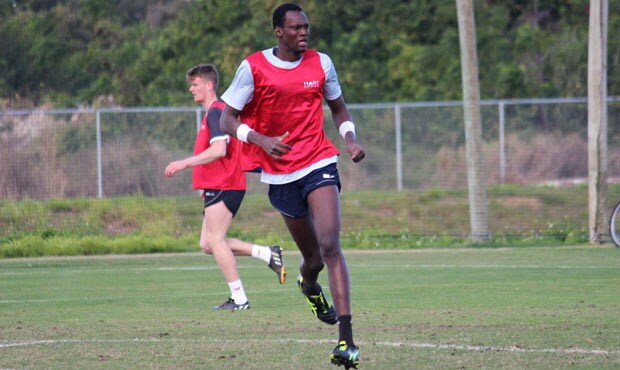 Tony Olango gets stuck into training during the NAB AFL Academy's trip to Florida - ${keywords}